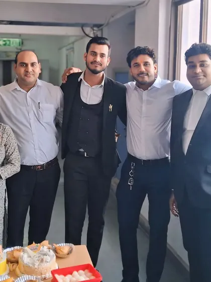 Celebrating a colleague's birthday at the office. We are more than just a team; we are a work family.