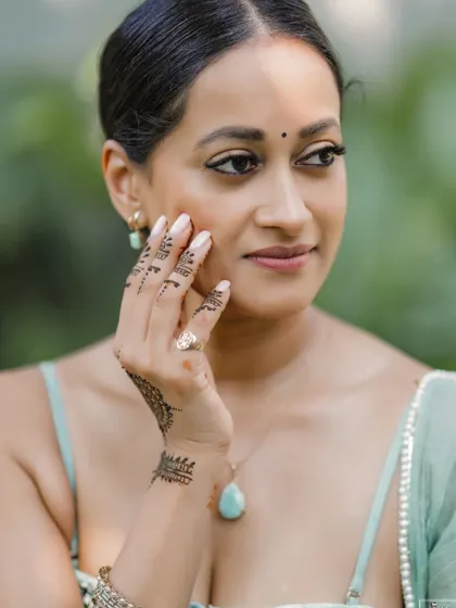 A close-up portrait of the bride from her Thailand Mehndi ceremony.