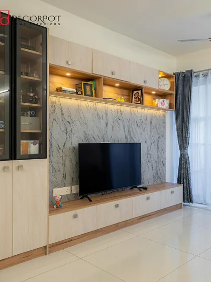 A full view of the TV unit from image 120, showing its scale and integration into the living space. The design provides a perfect balance of storage and display.