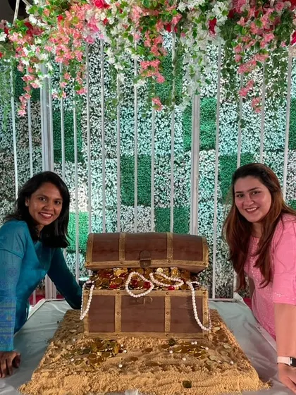 Posing proudly with my client next to the giant edible treasure chest cake we created for her event. This was a massive and rewarding project!