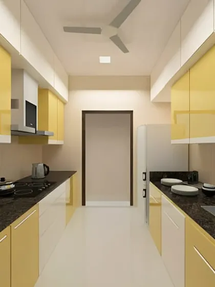 This parallel kitchen in a cheerful yellow is bright and efficient. The glossy cabinets and black granite countertops create a modern and energetic cooking space.