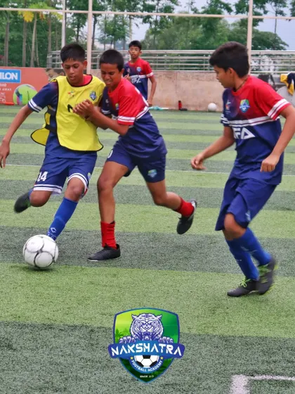 The spirit, commitment, and dedication for the game, all described in one picture. Players battling for possession of the ball.
