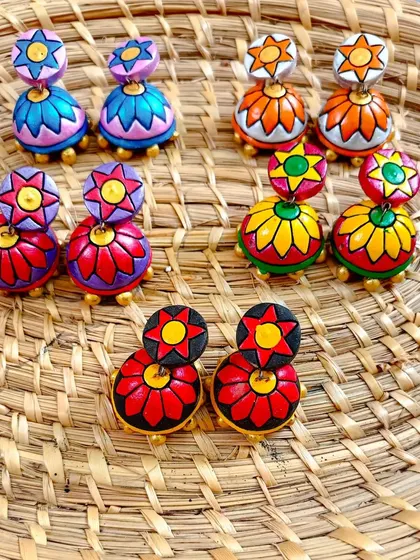 A collection of my best-selling two-tiered floral jhumkas. The vibrant color combinations make them a favorite for festive occasions.
