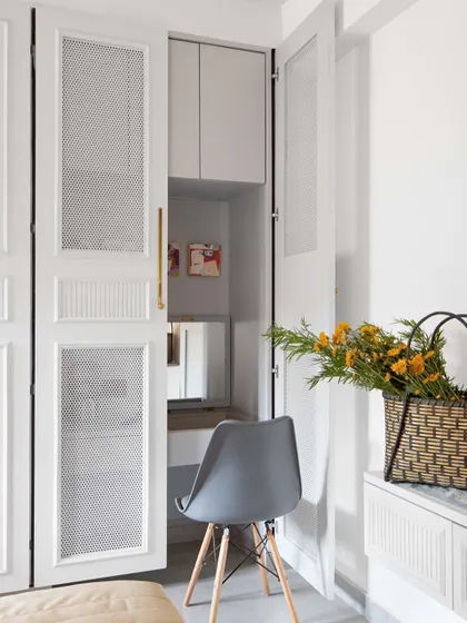 A clever design solution in one of the bedrooms. What appears to be a simple wardrobe opens up to reveal a compact, hidden study and vanity nook. This is a prime example of our approach to smart space planning and flexible interiors.