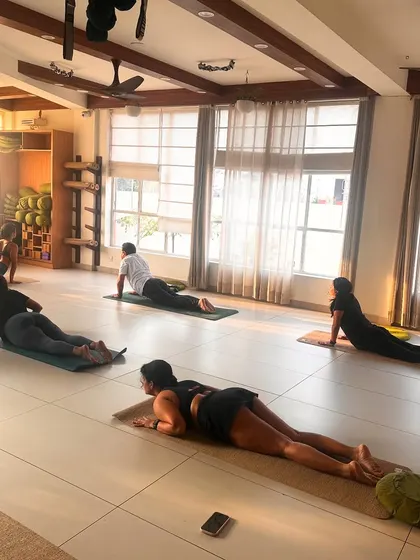 Students rest in a gentle backbend, allowing their bodies to absorb the benefits of the practice.