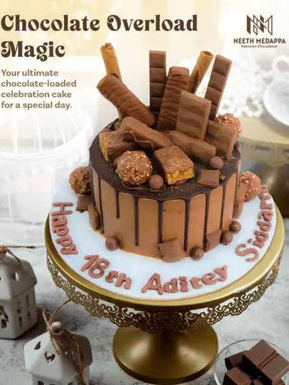 For the ultimate chocolate lover, I present the Chocolate Overload cake. This rich chocolate drip cake is loaded with an assortment of favorite treats like Ferrero Rocher, KitKats, and chocolate rolls, making it the perfect indulgent centerpiece for a milestone 18th birthday.