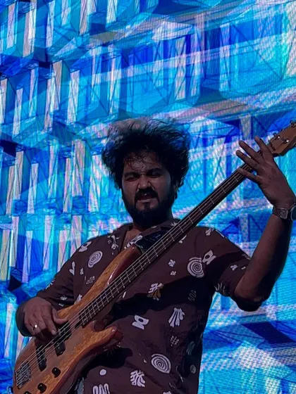 Our bassist in his element, laying down the groove for the Saraswat Bank team. The stage lighting and visuals were on point.