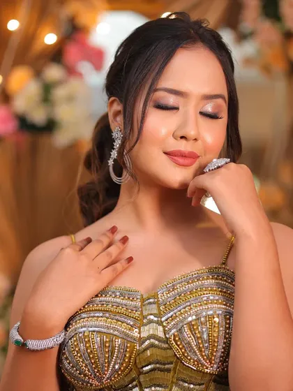 A moment of serene beauty. The soft, shimmery eye makeup and flawless skin are the highlights of this minimal glam look.