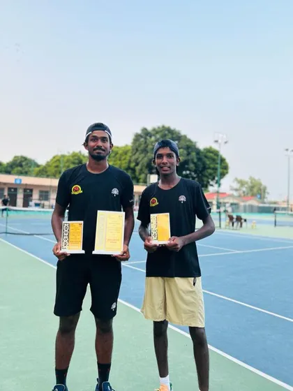 Our players Oges and Akshath posing with their doubles finalist awards.