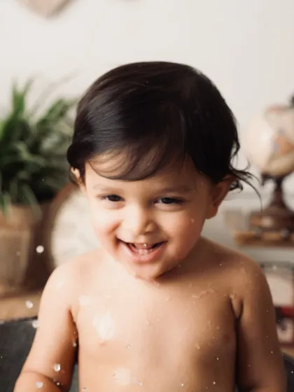 A huge, giggling smile from the baby in the tub. This is what pure, unadulterated happiness looks like.