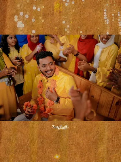 The groom's happy face as he is surrounded by family during his Haldi ceremony, a moment filled with love and tradition.