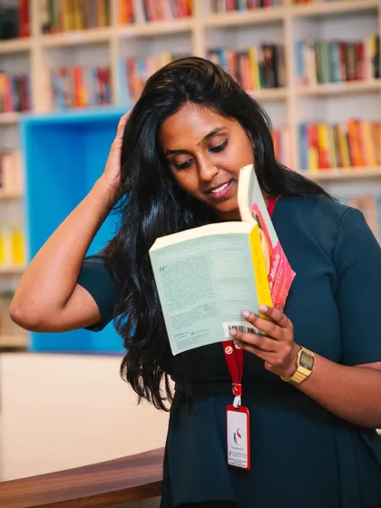A candid moment from a photoshoot in a library. I'm always learning and exploring new things.