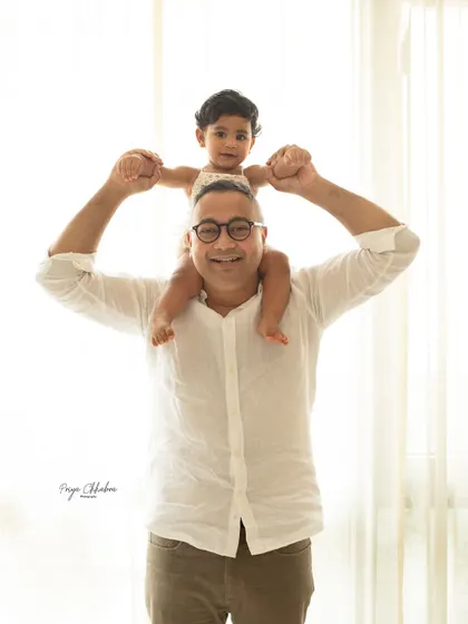 Adventures with daddy! There's no safer or more fun place than on dad's shoulders. This is a classic family portrait pose that always results in the biggest smiles.