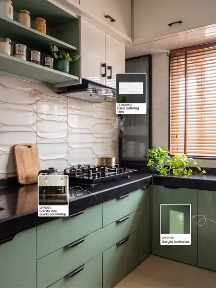 Here is a perfect example of a modern kitchen with a desi soul. I've tagged the exact materials used, from the sage green acrylic laminates to the wavy subway tiles and granite-look quartz countertop. This shows how you can get a high-end look with smart material choices that are both beautiful and practical.