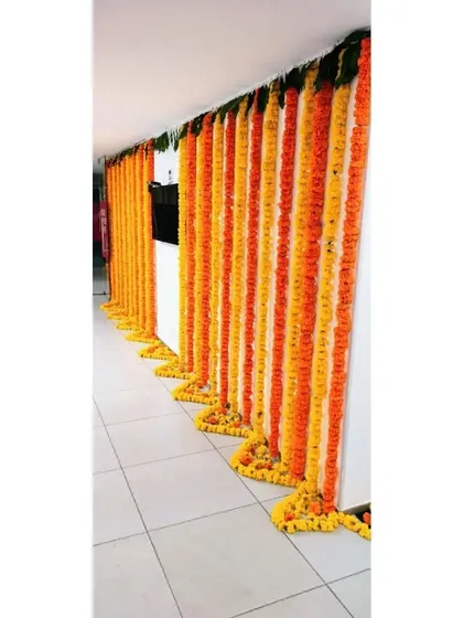This is an example of our corporate decoration services. We decorated the Pedigree office in Jogeshwari for Diwali with long, flowing garlands of orange and yellow marigolds, bringing festive spirit to the workplace.