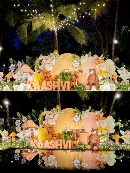 The enchanted woodland theme transitioning from day to night, with twinkling lights adding a magical glow to the setup.
