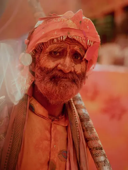A comprehensive photo series from Lathmaar Holi in Barsana. These images document the unique tradition where women playfully hit men with sticks, recreating a legend of Lord Krishna and Radha. The photos are filled with motion, color, and raw emotion.