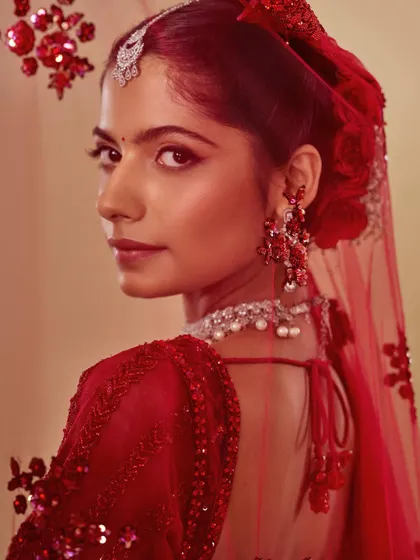 The red bride from another angle, showcasing the flawless base and the perfectly defined winged liner. My student Swastika understood the importance of balance in this timeless look.