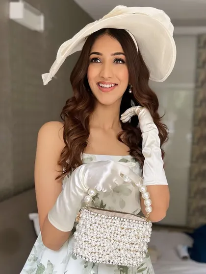 The complete look, with a beautiful smile. The soft makeup and vintage accessories come together to create a look straight out of a period drama.