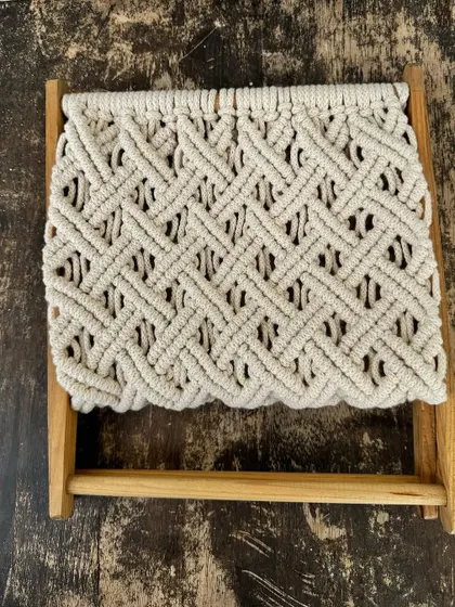 A simple, flat lay of the magazine holder, showing the intricate weaving pattern.