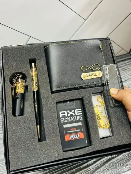 A premium Rakhi gift set with a personalized wallet, pen, keychain, perfume, and a matching bracelet.