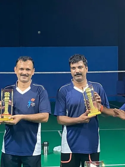 A group of four players with their well-earned trophies.