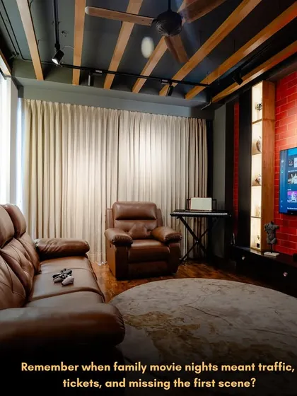 Forget traffic and tickets. I can bring the blockbuster experience right into your home. This is a custom home theatre I designed, complete with plush leather recliners, ambient track lighting, and an exposed brick wall for that rustic, industrial vibe.
