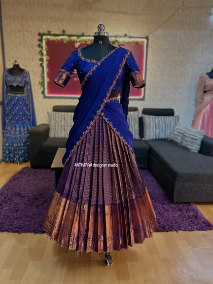 Full view of the royal blue and purple langa voni, showcasing the pleated silk skirt.