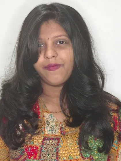 Another happy client showing off her new haircut, which features soft, face-framing layers.