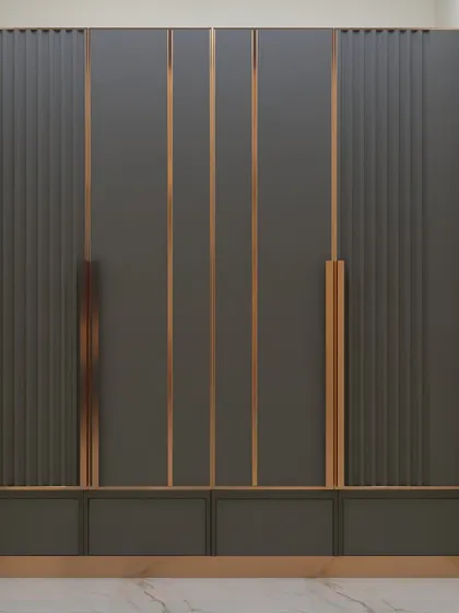 This wardrobe design makes a bold statement with its dark grey fluted panels and striking copper-gold accents. It's a perfect example of how storage can become a central decorative feature in a room.