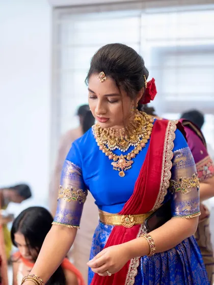An elegant pose capturing the essence of a Telugu beauty. The makeup is soft and glowing, ensuring she looks and feels her best during her bangle ceremony.