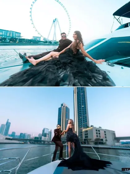A glamorous pre-wedding shoot on a yacht in Dubai. This black high-low gown with a dramatic ruffled train is perfect for a chic and modern couple.