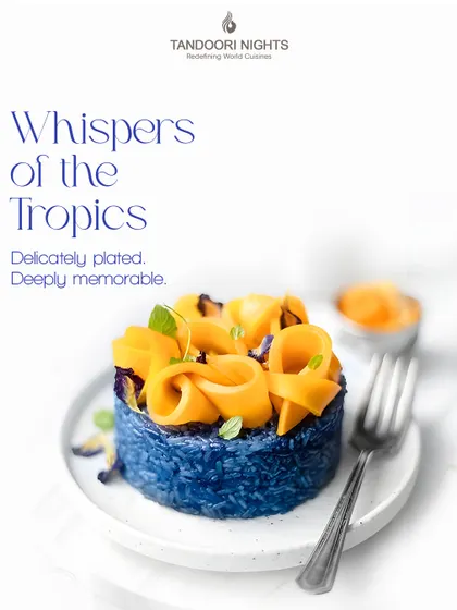Whispers of the Tropics. This stunning dessert with blue pea rice and mango roses is delicately plated and deeply memorable, perfect for a summer event.