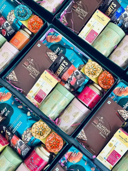 The rich textures and colors of the snacks and diyas inside our corporate Diwali hampers make for a visually appealing gift.