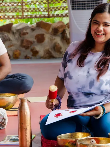 The smile of a student as she practices with her singing bowl. This is the happiness that comes from connecting with your inner artist and healer.