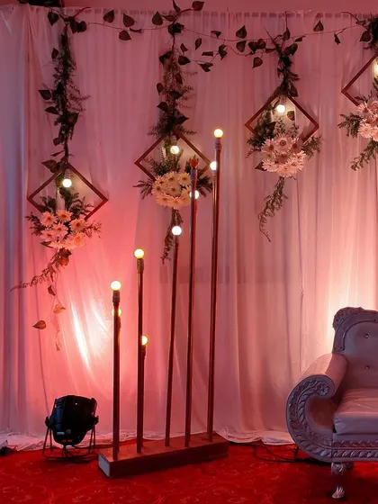 A closer shot of the modern reception stage with geometric frames and lighting.