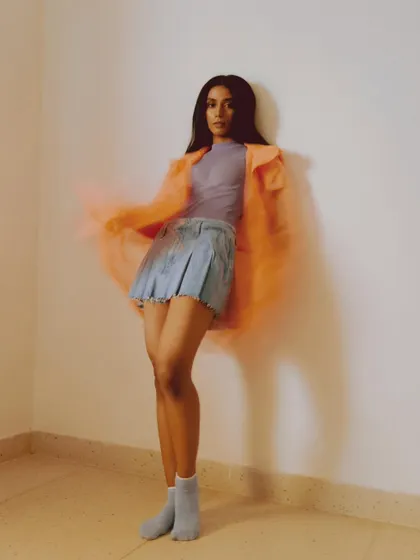 An experimental shot from the archives using a slow shutter speed. I layered a sheer neon orange jacket over a denim skirt and pastel top to create a dreamy, colorful look with a sense of motion.