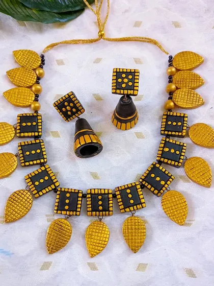 More color variations of the popular square and leaf necklace, including pink, and another view of the black and gold, showing the depth of my inventory.