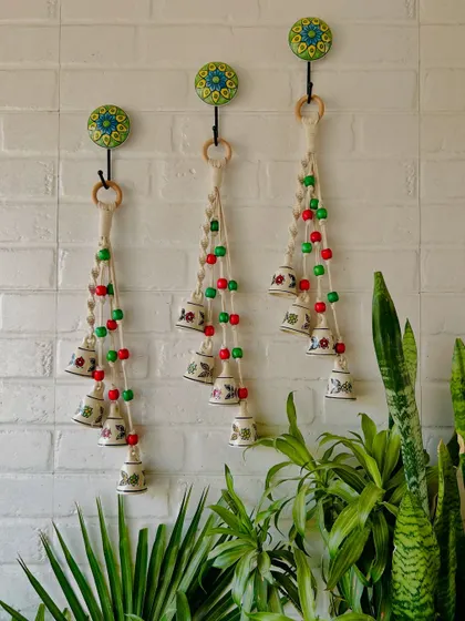 Our 2024 Christmas Collection is here. This image displays our festive bell decorations, handmade with small and big ceramic bells and colorful wooden beads, perfect for adding a touch of holiday cheer.