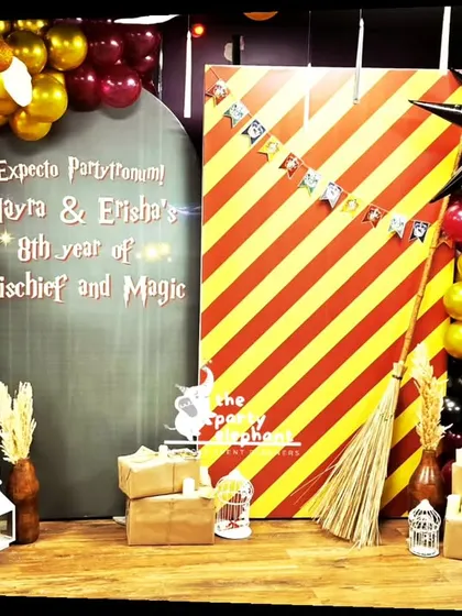 A detailed shot of the Harry Potter photo booth, showcasing the star-shaped balloons and other props that added to the magical and mischievous theme of the party.