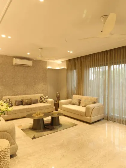 Another perspective of the Monochrome Oasis living area, showing the elegant POP moldings and wall coves that add depth and character.