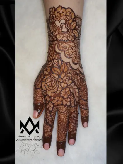 A single hand view of the romantic floral design, showing how the pattern flows from the wrist to the fingers.