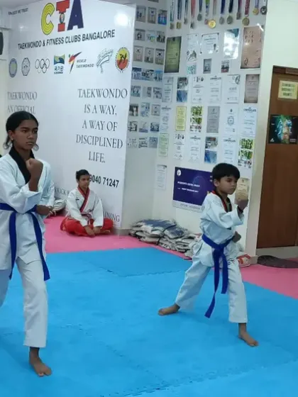 The same two students executing a block in their form.