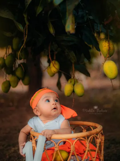 Looking up in wonder at the mangoes. The natural light and beautiful scenery make outdoor shoots so special.
