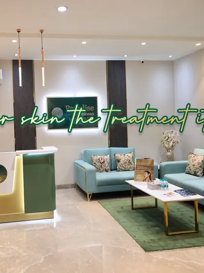 A wide shot of our clinic's welcoming reception and waiting lounge. We have created a space where luxury is accessible and you can feel comfortable starting your journey to better skin.