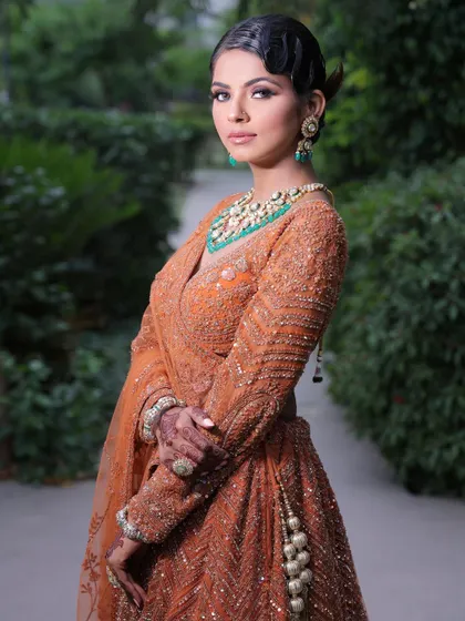 My styling services extend beyond the wedding day to any special event. This elegant party look features soft, glamorous makeup and a chic hairstyle, perfect for a sangeet, reception, or any celebration.