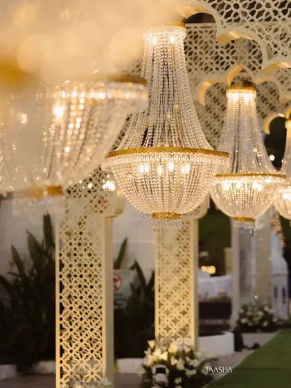 It's all in the details. This close-up shows the elegant crystal chandeliers I used to line a grand entryway, adding a touch of royalty and glamour to the entire wedding reception experience.