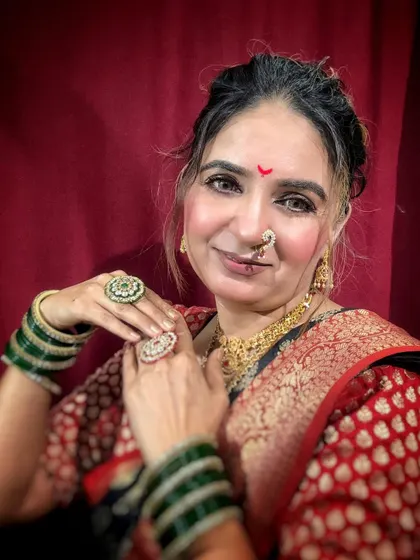 Details of the Ganesh Chaturthi look, showing the beautiful jewelry and the subtle, glowing makeup.