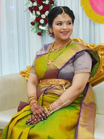 The stunning mom-to-be, Sagarika, at her baby shower, her hands beautifully adorned with my custom mehendi design.