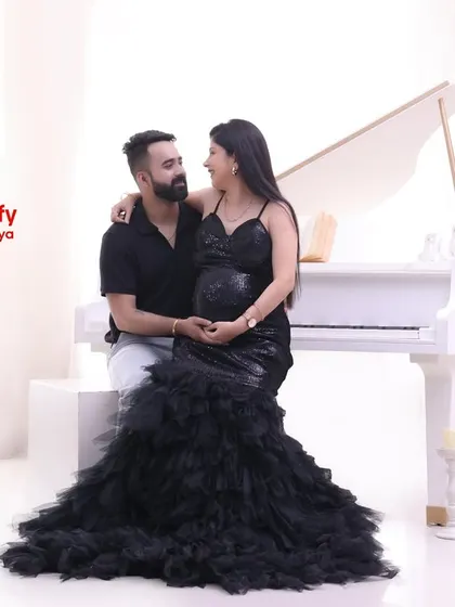 A sweet, seated pose from our Grand Piano maternity theme. The couple shares an intimate moment, creating a memory of love and music.